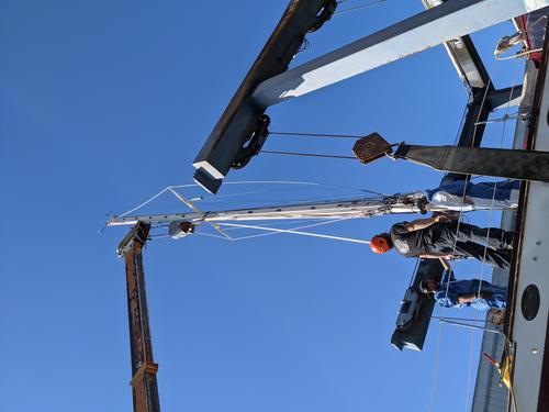 Mast being stepped 1
